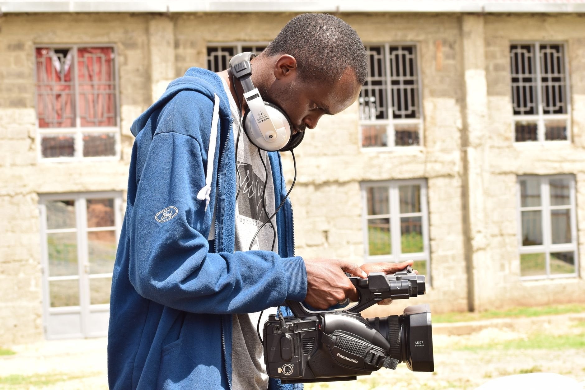 African videographer filming content outdoors in Nairobi